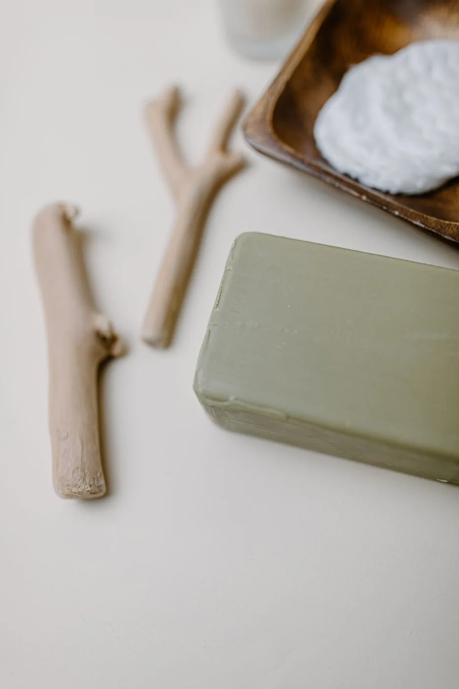 Cotton pads and daily care essentials on a bathroom tray