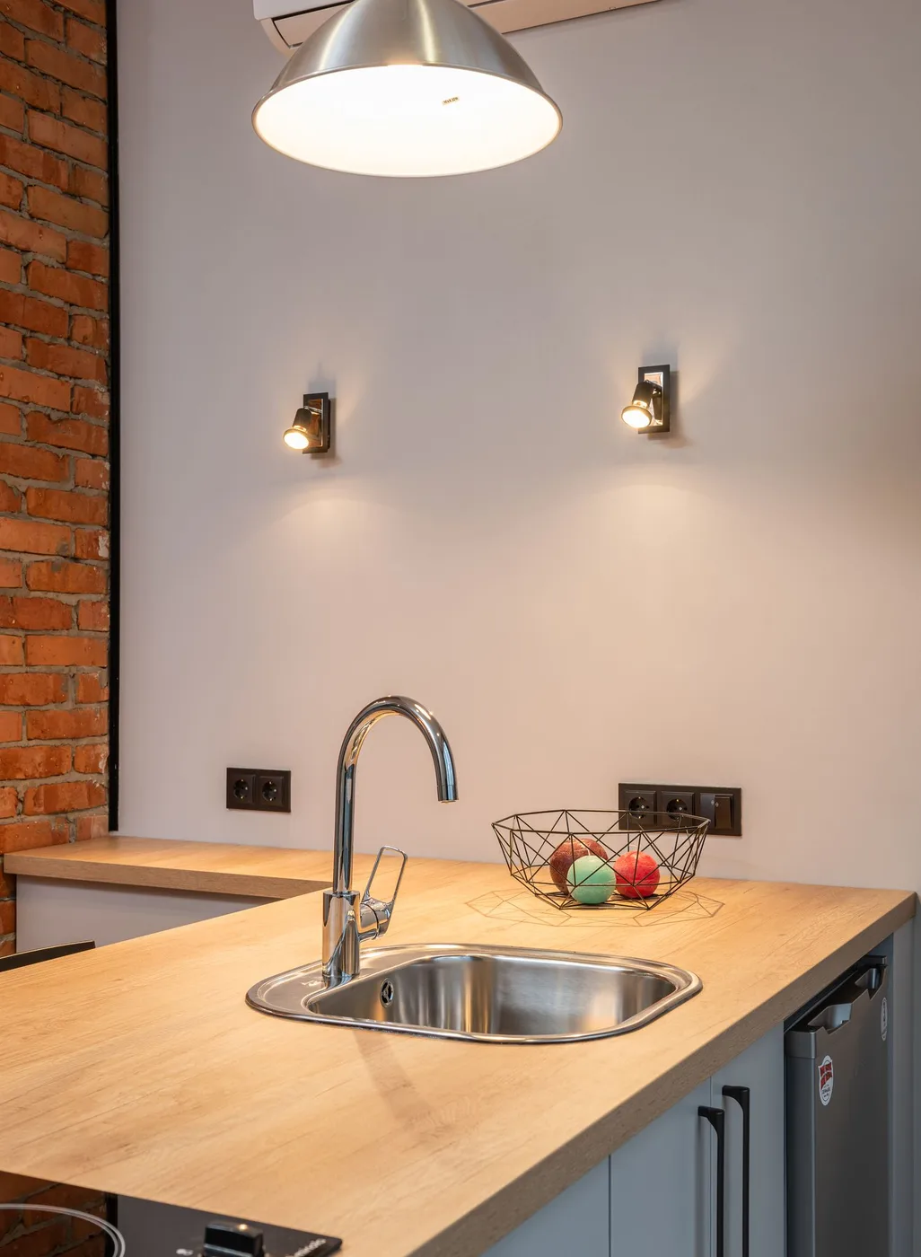 A compact, thoughtfully arranged kitchen with a wooden counter